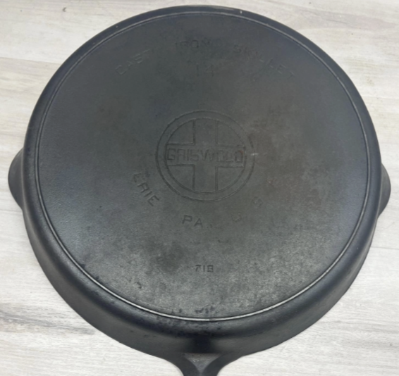 iswold number 14 large block logo EPU cast iron skillet with heat ring, pattern number 718. Said to "sit flat." Sold for $650. 